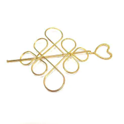 Vackert hårsmycke av hög kvalitet - snirkligt mönster guld